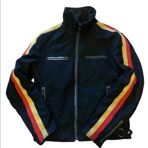 black jacket with yellow and red lining along sleeves